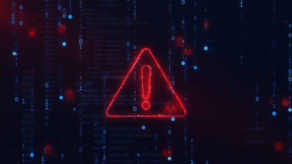 Glowing red warning triangle with an exclamation mark on a dark background, surrounded by binary code and security symbols, representing a ransomware attack