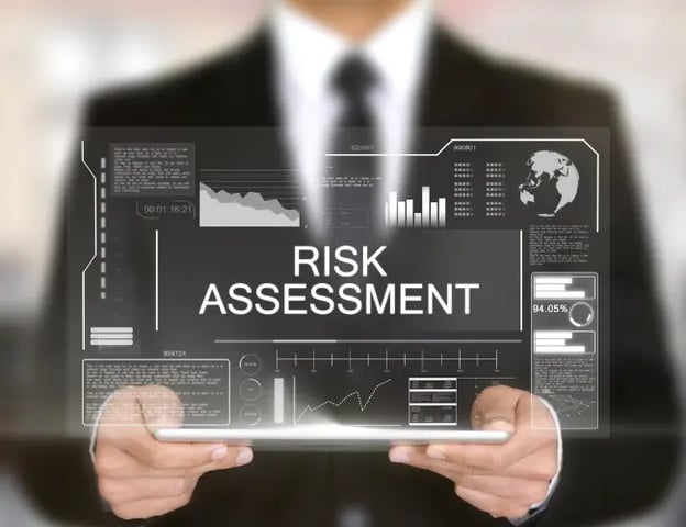 User Holding a 3D View of an IT Risk Assessment Dashboard