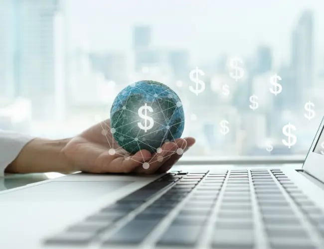 Visual representation of cost saving by cloud security monitoring as a user holds a globe with money signs.