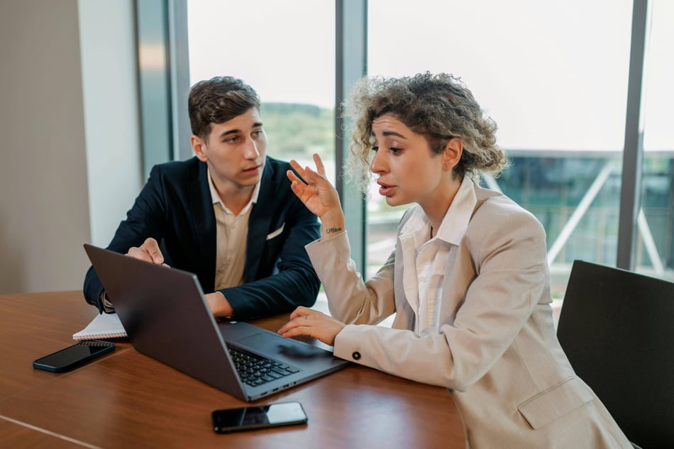 People collaborating on a laptop